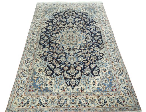 Surface texture of 2000s Nain rug with natural Wool and intricate pattern