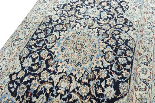 Backside of handmade 2000s Nain rug showing knot structure and weave density
