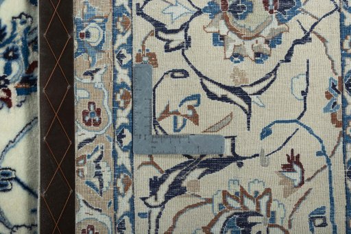 Backside of handmade New Nain rug showing knot structure and weave density