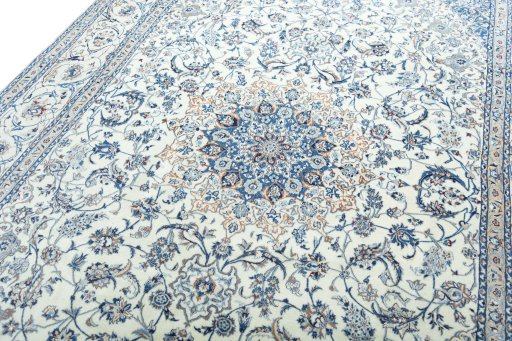 Backside of handmade New Nain rug showing knot structure and weave density