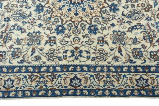 Corner detail of 2000s Nain rug showing border pattern and Wool pile