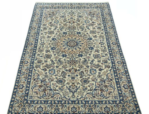 Surface texture of 2000s Nain rug with natural Wool and intricate pattern