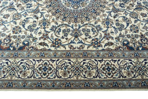 Corner detail of 2000s Nain rug showing border pattern and Wool pile