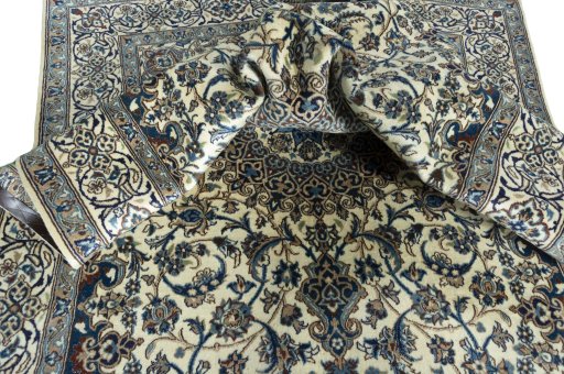 Surface texture of 2000s Nain rug with natural Wool and intricate pattern