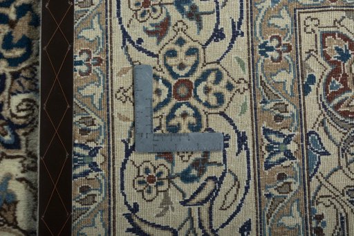 Backside of handmade 2000s Nain rug showing knot structure and weave density