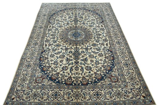 Surface texture of 2000s Nain rug with natural Wool and intricate pattern