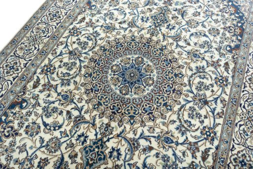 Backside of handmade 2000s Nain rug showing knot structure and weave density