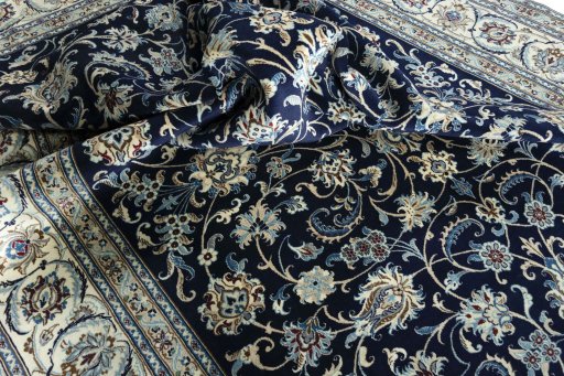 Surface texture of 2000s Nain rug with natural Wool and intricate pattern