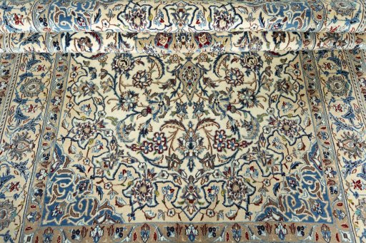 Corner detail of 2000s Nain rug showing border pattern and Wool pile
