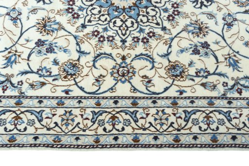 Corner detail of 2000s Nain rug showing border pattern and Wool pile