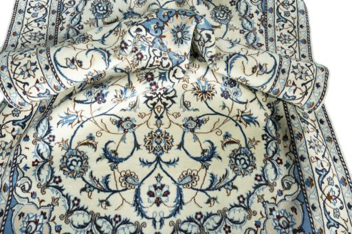 Surface texture of 2000s Nain rug with natural Wool and intricate pattern