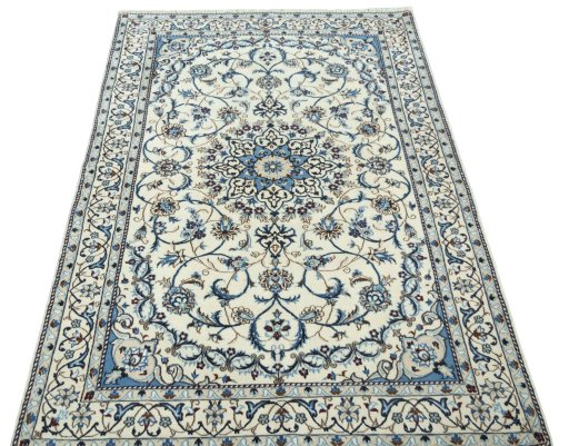 Surface texture of 2000s Nain rug with natural Wool and intricate pattern