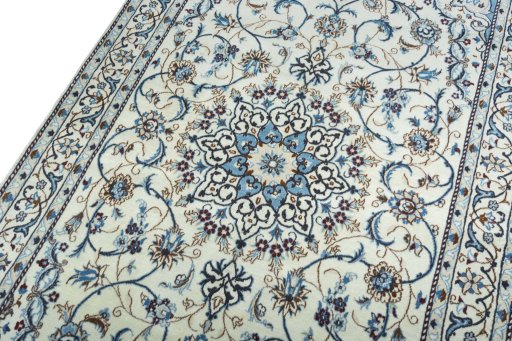Backside of handmade 2000s Nain rug showing knot structure and weave density