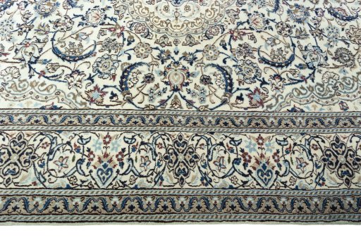 Corner detail of 2000s Nain rug showing border pattern and Wool pile