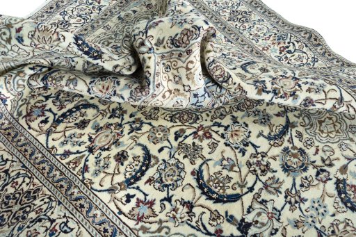Surface texture of 2000s Nain rug with natural Wool and intricate pattern