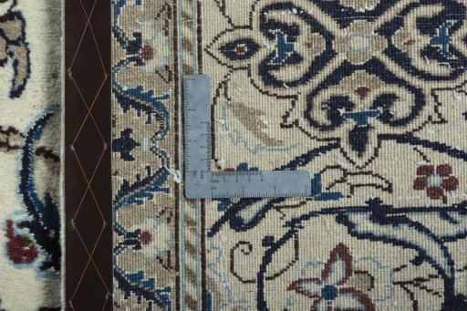 Backside of handmade 2000s Nain rug showing knot structure and weave density