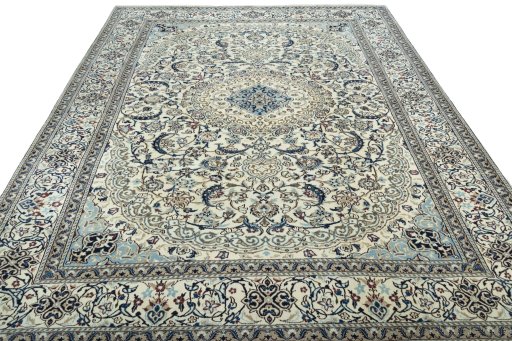 Surface texture of 2000s Nain rug with natural Wool and intricate pattern