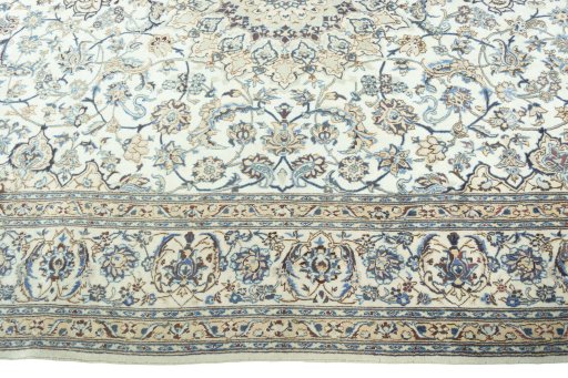 Corner detail of 2000s Nain rug showing border pattern and Wool pile