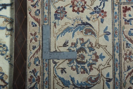 Backside of handmade 2000s Nain rug showing knot structure and weave density