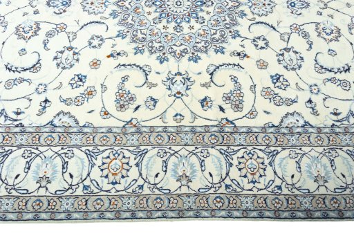 Corner detail of 2000s Nain rug showing border pattern and Wool pile