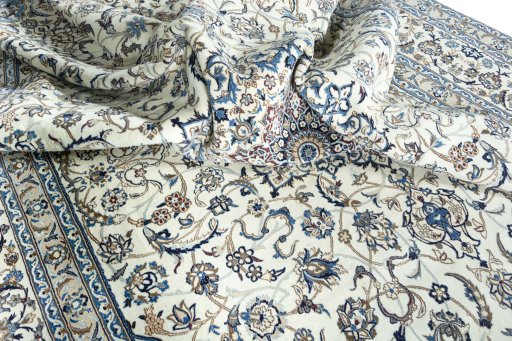 Surface texture of 2000s Nain rug with natural Wool and intricate pattern