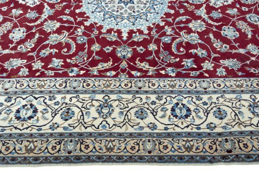 Corner detail of 2000s Nain rug showing border pattern and Wool pile