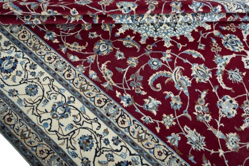 Close-up detail of 2000s Nain rug from Iran / Persia showing Wool weave