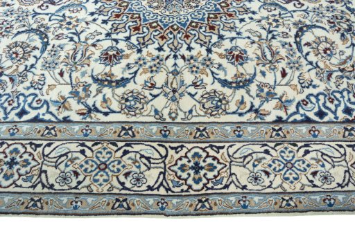 Corner detail of 2000s Nain rug showing border pattern and Wool pile