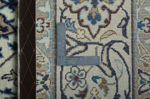 Backside of handmade 2000s Nain rug showing knot structure and weave density