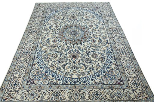 Surface texture of 2000s Nain rug with natural Wool and intricate pattern