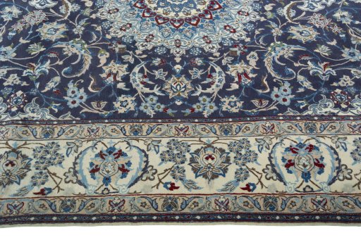 Corner detail of 2000s Nain rug showing border pattern and Wool pile