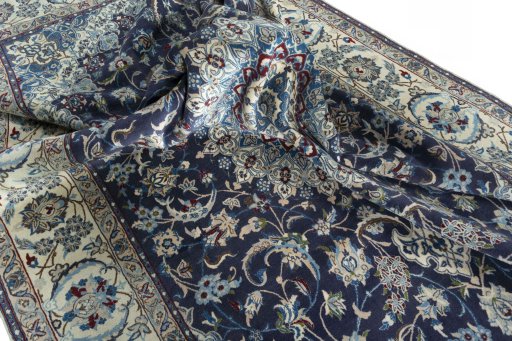 Surface texture of 2000s Nain rug with natural Wool and intricate pattern