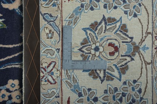 Backside of handmade 2000s Nain rug showing knot structure and weave density