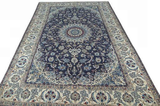 Surface texture of 2000s Nain rug with natural Wool and intricate pattern
