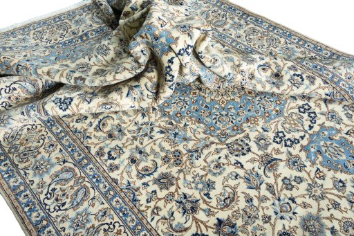 Surface texture of 2000s Nain rug with natural Wool and intricate pattern