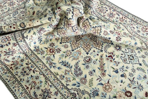 Surface texture of 2000s Nain rug with natural Wool and intricate pattern