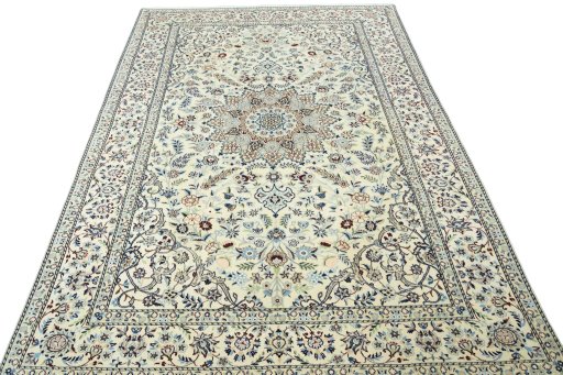 Surface texture of 2000s Nain rug with natural Wool and intricate pattern