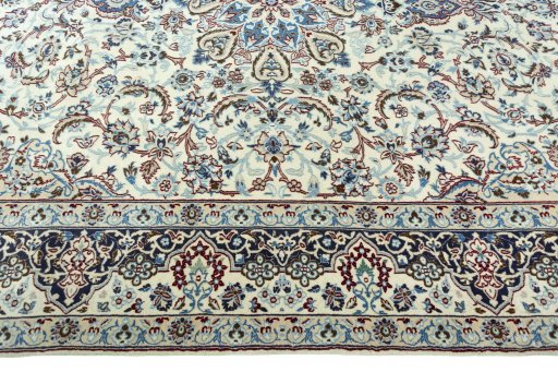 Corner detail of 2000s Nain rug showing border pattern and Wool pile