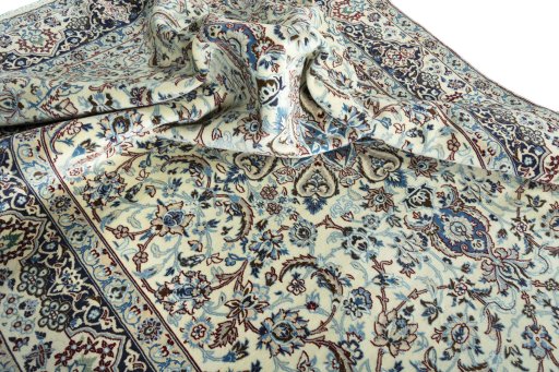 Surface texture of 2000s Nain rug with natural Wool and intricate pattern