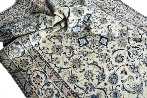 Surface texture of 2000s Nain rug with natural Wool and intricate pattern