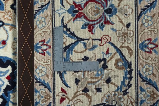 Backside of handmade 2000s Nain rug showing knot structure and weave density
