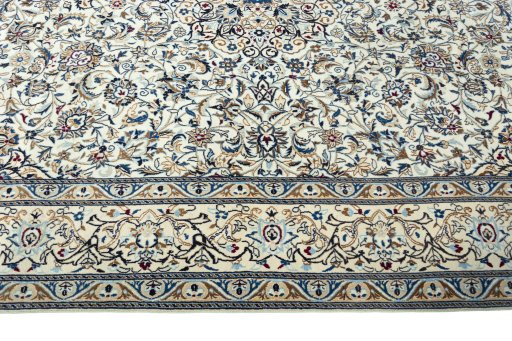 Corner detail of 2000s Nain rug showing border pattern and Wool pile