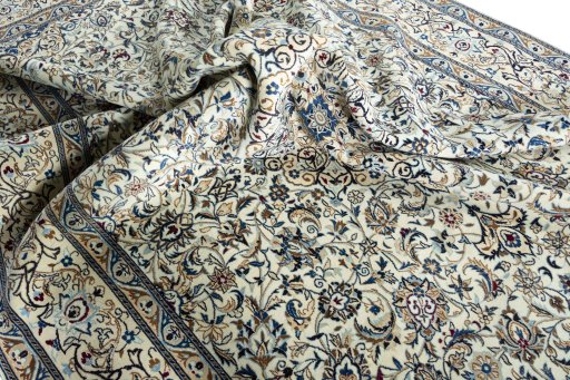 Surface texture of 2000s Nain rug with natural Wool and intricate pattern