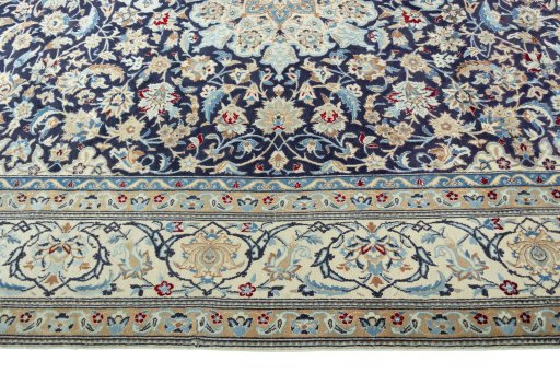 Corner detail of 1970s Nain rug showing border pattern and Wool pile