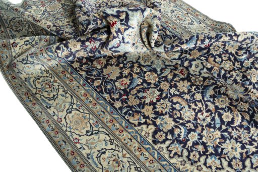 Surface texture of 1970s Nain rug with natural Wool and intricate pattern