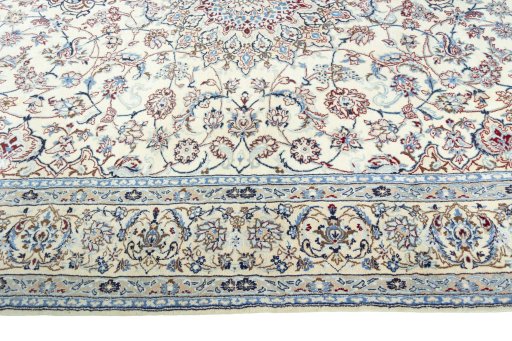 Corner detail of 2000s Nain rug showing border pattern and Wool pile
