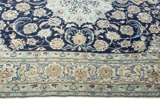 Corner detail of 2000s Nain rug showing border pattern and Wool pile