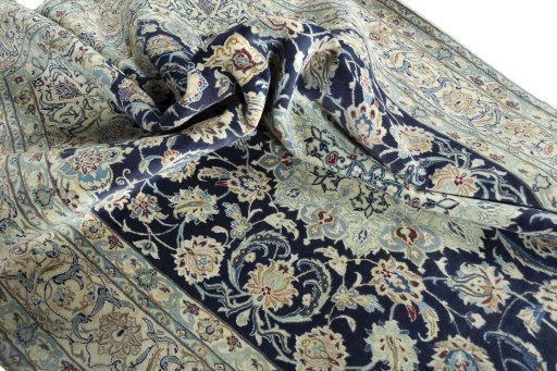 Surface texture of 2000s Nain rug with natural Wool and intricate pattern