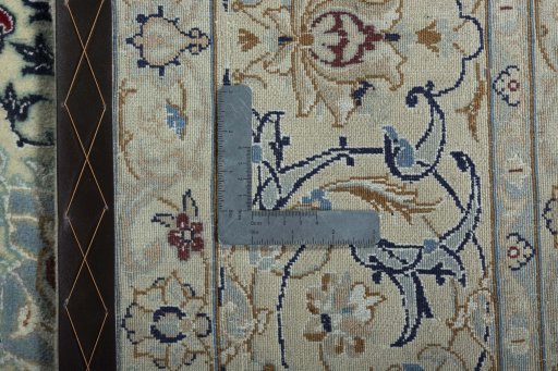 Backside of handmade 2000s Nain rug showing knot structure and weave density