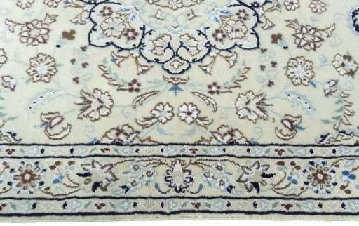 Corner detail of 2000s Nain rug showing border pattern and Wool pile